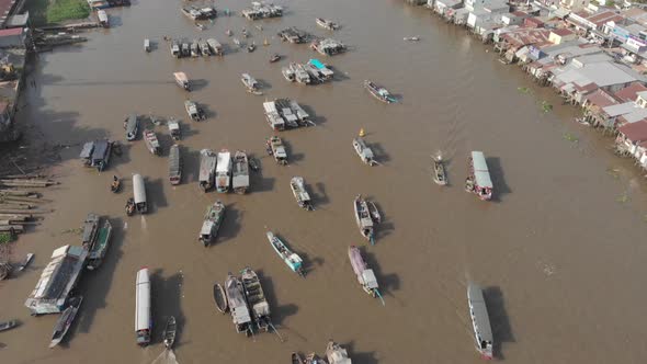 Aerial: flying over Cai Rang floating market Can Tho, Vietnam