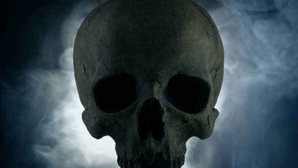 Dark Skull Lit Up With Glowing Smoke