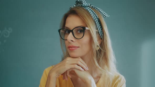 Portrait of a Pretty Young Blonde Woman in Retro Style