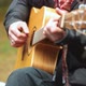man in black clothes playing acoustic guitar outdoors - VideoHive Item for Sale