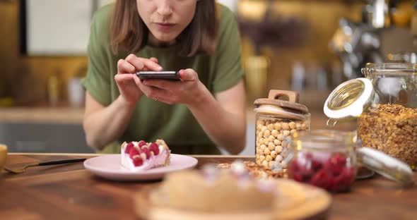 Woman Photographing Dessert on a Smartphone