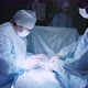 Female surgeon finishing operation - VideoHive Item for Sale