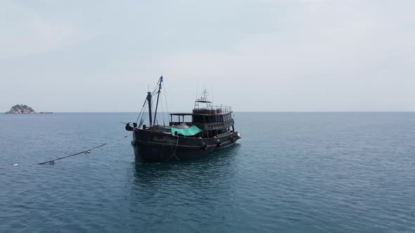 A Panoramic View of Classic Wooden Boat Fast Moving