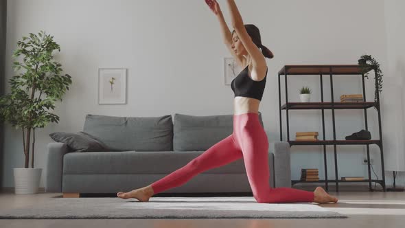 Woman Doing Splits on Floor