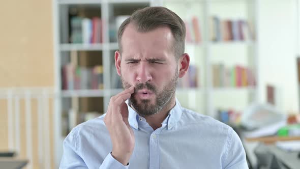 Portrait of Allergic Young Man with Toothache 