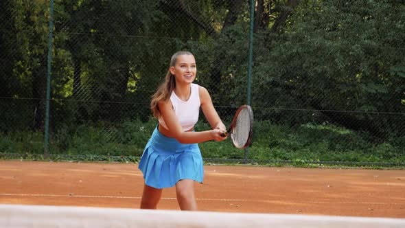 Teenage girl excited tennis win. Slow motion young female sportsman celebrates win match in tennis g