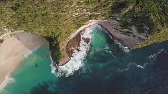 Aerial overhead view of Kelingking Beach in Nusa Penida, Bali, Indonesia.