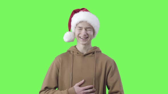 Funny Cheerful Caucasian Boy Laughing Out Loud at Chromakey Background. Portrait of Positive
