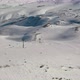 Aerial View Snow Mountain Peak Clouds in Background  Winter Drone Footage Ski Resort - VideoHive Item for Sale