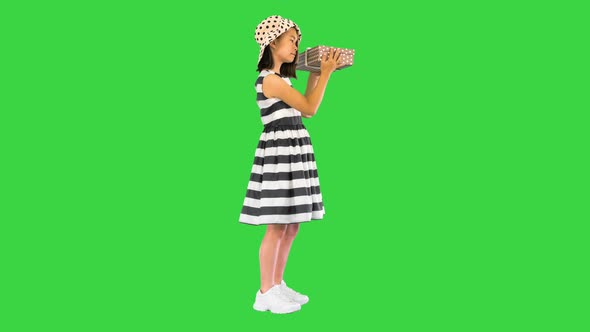 Holidays Presents Christmas Xmas Birthday Concept Happy Child Girl with Gift Box on a Green Screen