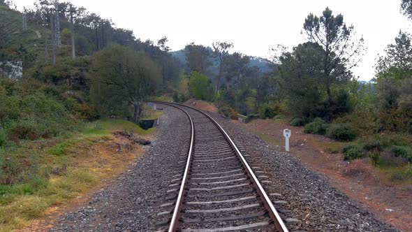 POV Along Empty Railway Tracks Towards Tunnel Near Town Of Gundián, Vedra, Coruña, Galicia