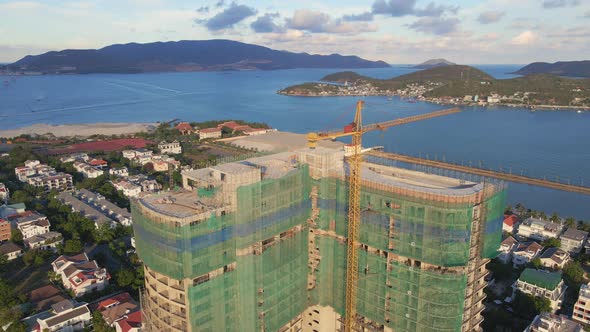 Aerial Shot of the Construction Site with One Onstruction Crane. Tall Building Construction Concept