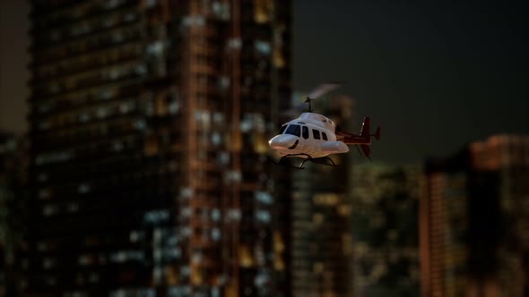 Slow Motion Helicopter Near Skyscrapers at Night