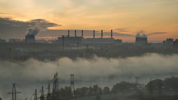 Autumn morning fog with a view of the factory