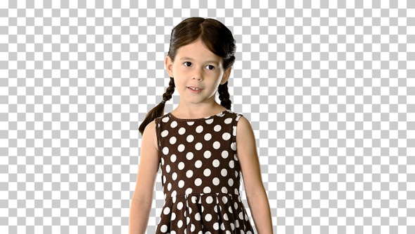 Confident little girl in polka dot dress, Alpha Channel