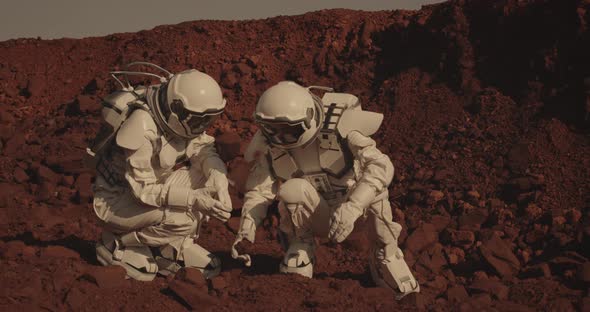 Astronauts Collecting Rock Samples on Mars alt