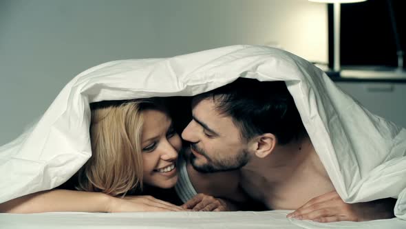 Playful Lovers in Bed 