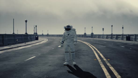 Astronaut Walks in the Middle of a Road alt