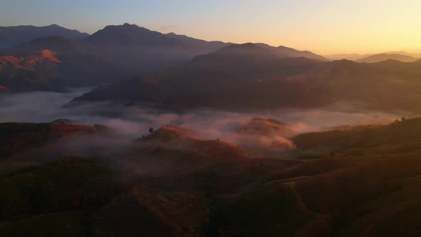 Flying over the clouds during morning sunrise.  wonderful morning sunrise natural Landscape.