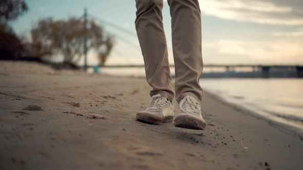 Businessman Walks And Enjoying Good Weather At Fall. Man Feet Walking On Beach. Man Walking On Sand.