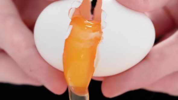 HD - Hands breaking an egg. Close-up and slow-mo video