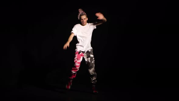 Professional Young Hip-hop Dancer, Dancing in Dark Studio in the Fog. Hip Hop Culture. Rehearsal