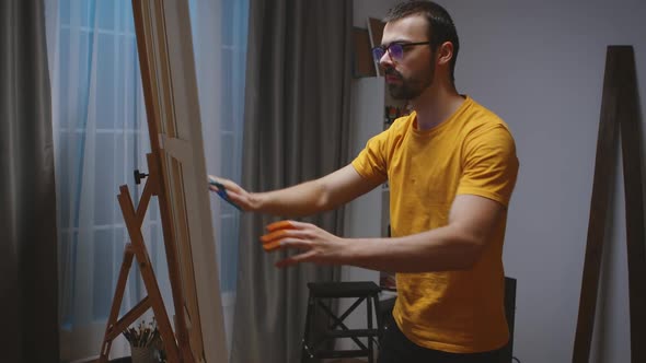 Guy Working on Painting