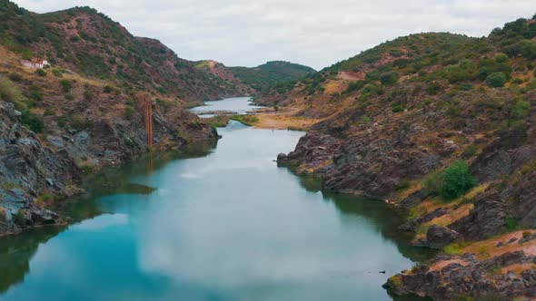 Aerial View of the Mountain River Near Mertola