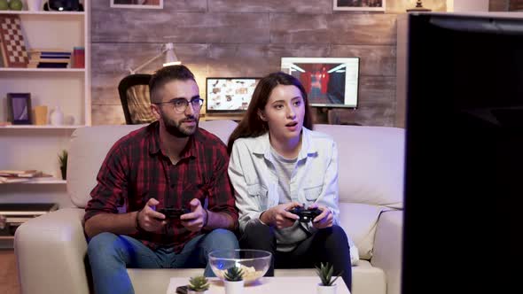 Couple Giving High Five After Playing Video Games