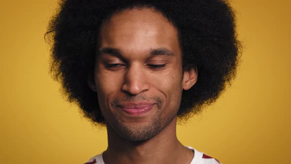 Close up portrait of smiling African man in studio shot. Shot with RED helium camera in 8K.