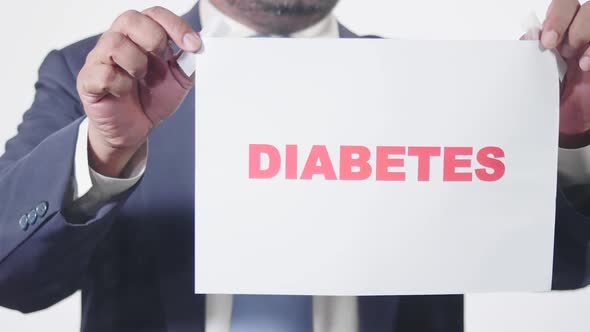 Businessman Posts Sign On Window Diabetes