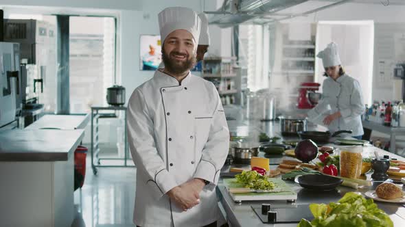 Portrait of Male Chef Looking at Camera in Professional Kitchen