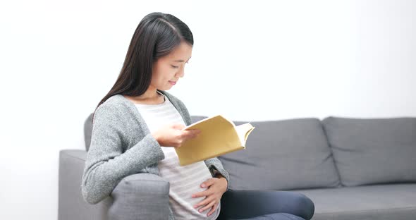 Pregnant woman reading book