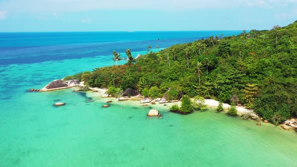 Beautiful birds eye abstract shot of a white sandy paradise beach and blue water background in hi re