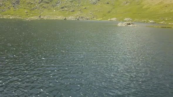 Lake at the top of a mountain in the Lake District.