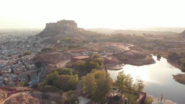 Aerial drone footage traveling along a hill top ridge above the vast city of Jodhpur, India. 