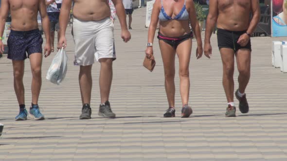 Walking Shirtless on a Boardwalk