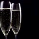 Two glasses of champagne with bubbles on black background. - VideoHive Item for Sale