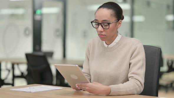 Creative African Woman Using Digital Tablet