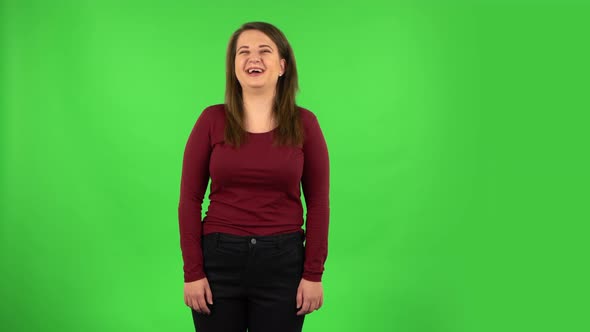 Pretty Girl Bursting with Laughter Being in Positive. Green Screen