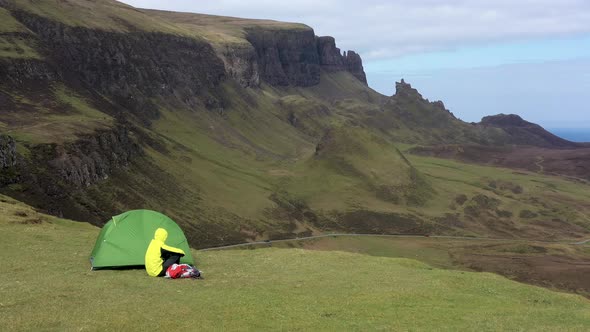 Man adventurer with backpack exploring Isle of Skye