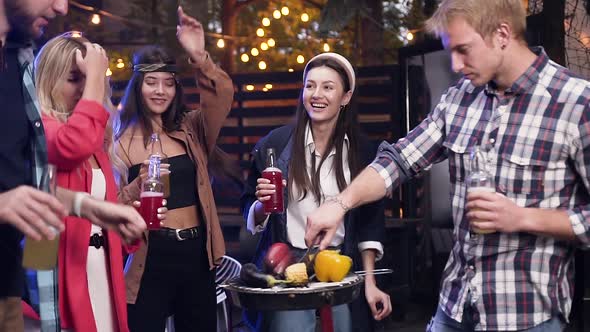 Group of Joyful Attractive 30s People Dancing to the Incendiary Music and Having Fun Together