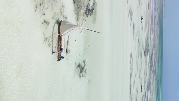 Vertical Video of Low Tide in the Ocean Near the Coast of Zanzibar Tanzania Aerial View