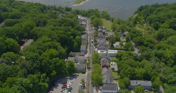 Aerial View of a Small Town Neighborhood and Boats Anchored on Harbor