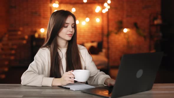 A Woman is Sitting in Her Home Office