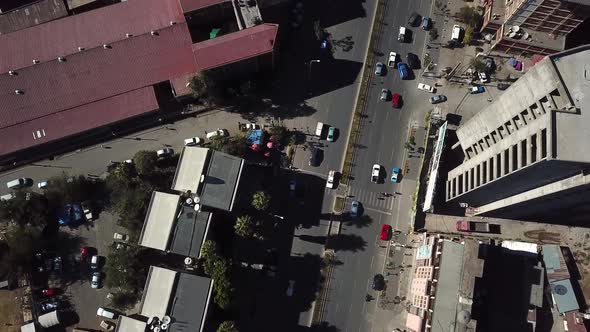 Road traffic aerial reveal of metropolitan cityscape in African modern city. Addis Ababa, Ethiopia