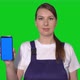 Woman Builder in Blue Overalls Hold Mobile Phone with Green Screen - VideoHive Item for Sale