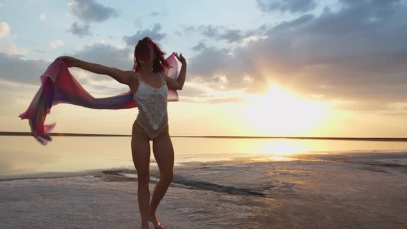Freedom, Young Woman with Pareo in Hand Is Dancing on the Beach, Summer Vacation
