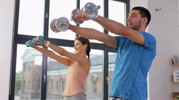 Happy Couple Exercising at Home