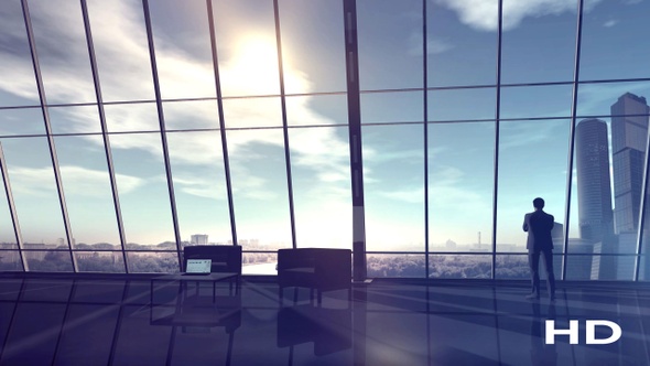 Businessman In The Office Opposite A Large Window HD